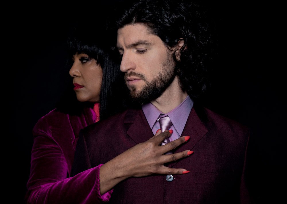Portrait of couple dressed in purple
