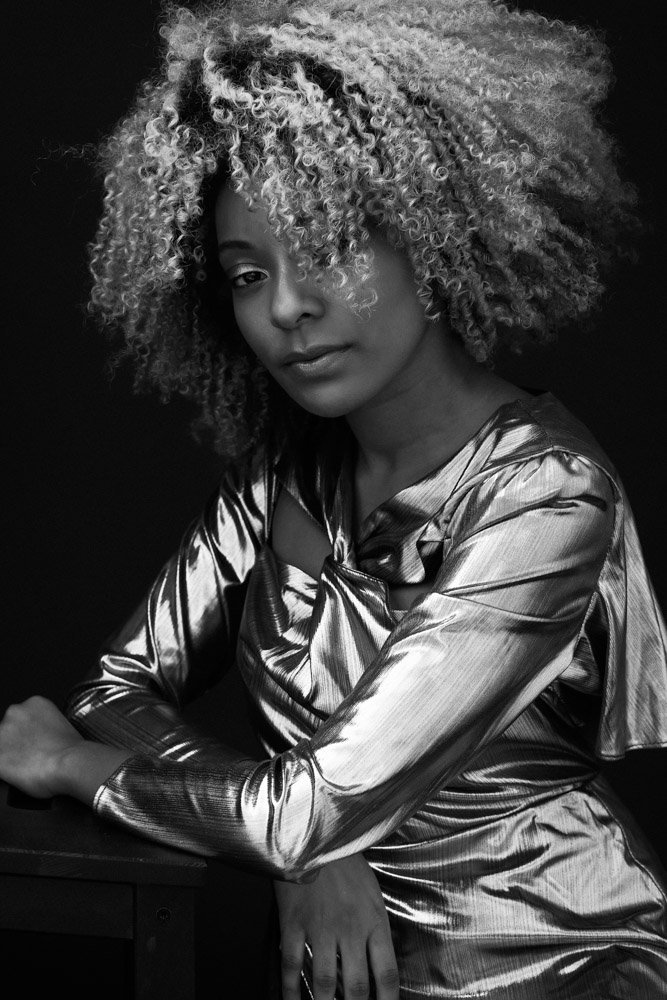 Black and wihite portrait of a woman with afro hair