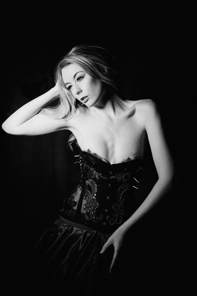 black and white portrait of a woman wearing a bustier