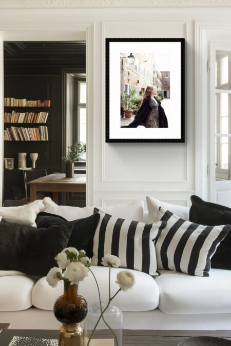 Fine art photograph of a woman dancing freely in a London mews, capturing an ethereal, joyful moment in the city.