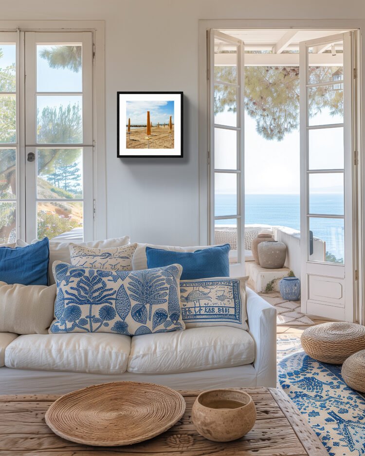 Bring the warmth of the Italian seaside into your home with our 'Venice Lido, Yellow Umbrellas Art Print.' This art print captures the essence of an early morning at Venice Lido beach, with rows of yellow umbrellas set against a blue sky.